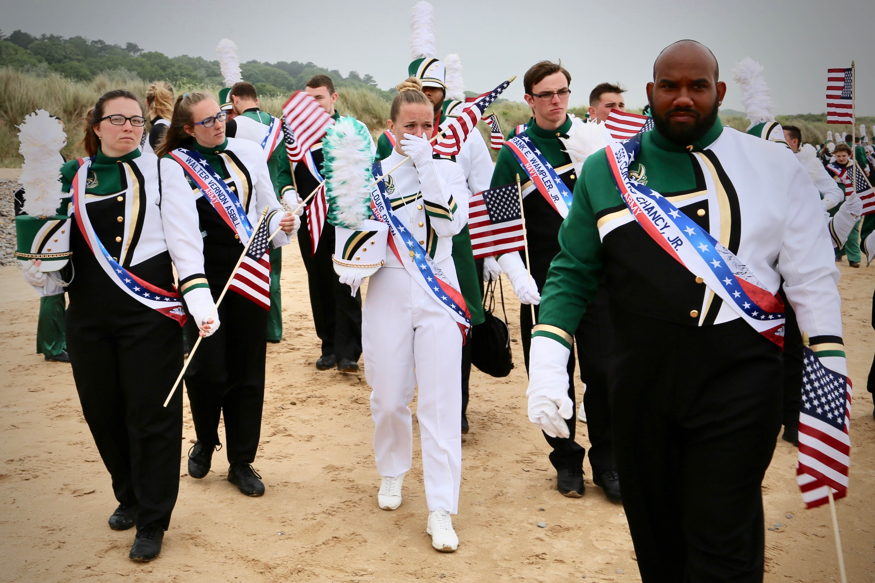 Assistant Drum Major Madelyn Palko, center, with bandmates taking their first steps on Omaha Beach.