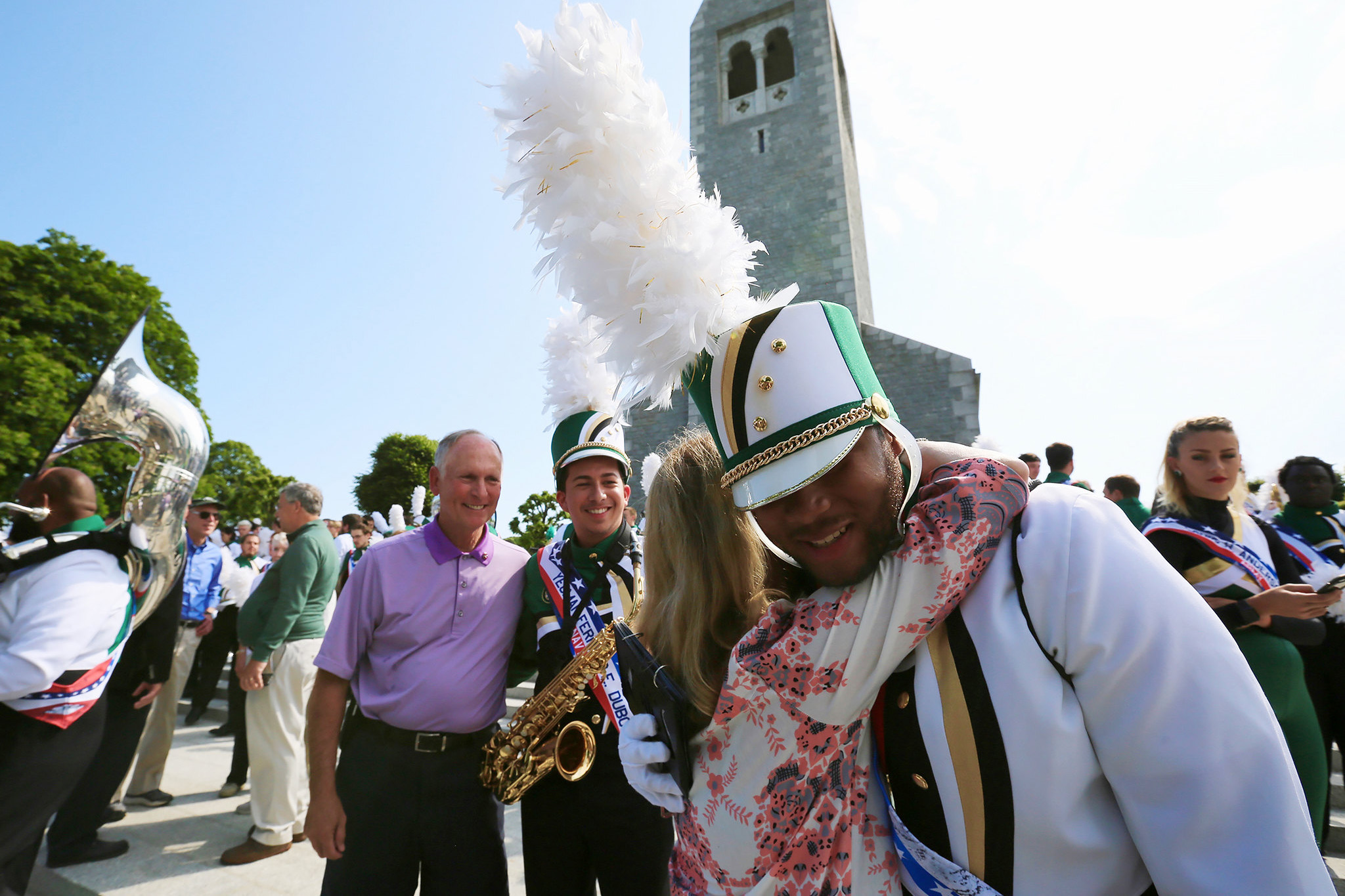 Chancellor Philip and Lisa Dubois greet the band following its performance at the Brittany American Cemetery.