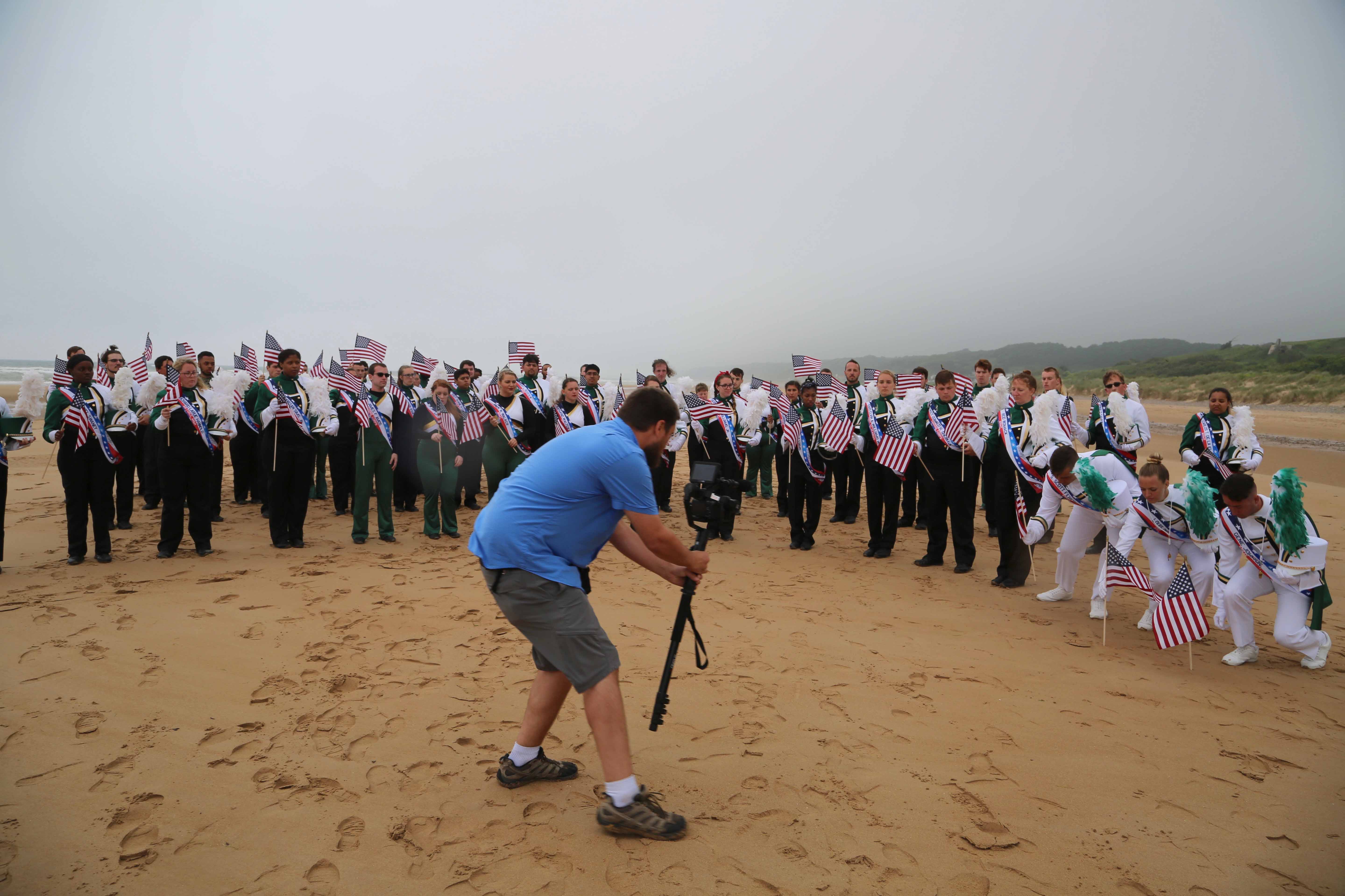 Cinematographer Harrison Hieb captures the flag planting for Origins of Opportunity, the documentary connecting the band’s journey and UNC Charlotte’s beginnings in the wake of World War II.